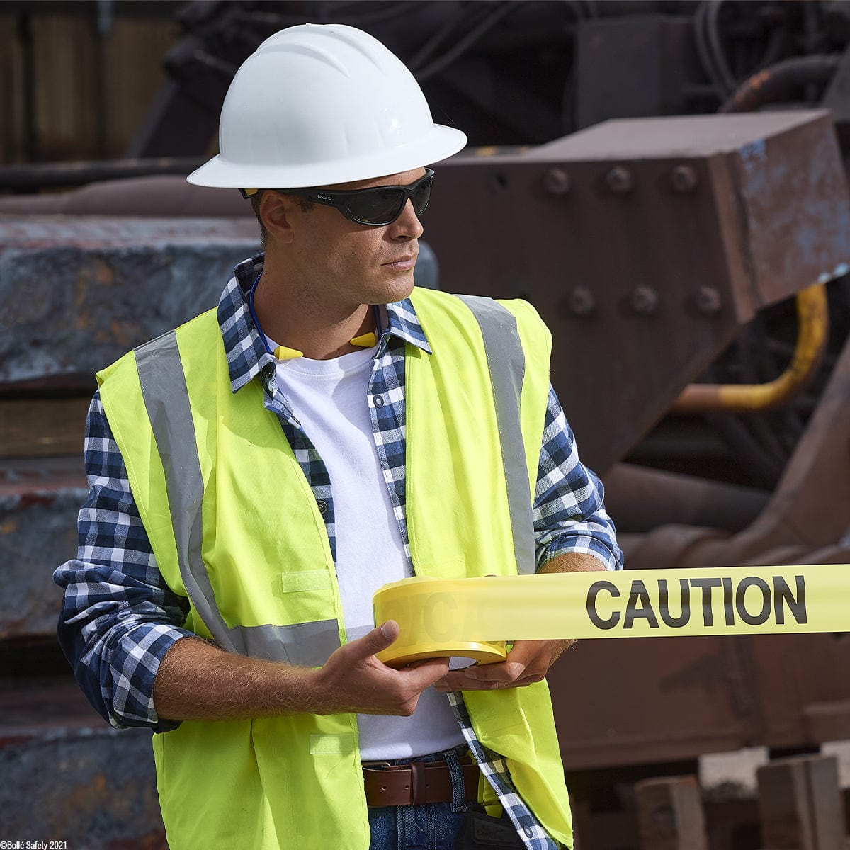 Bolle Komet Safety Glasses with Polarized Smoke Lens worn on the jobsite
