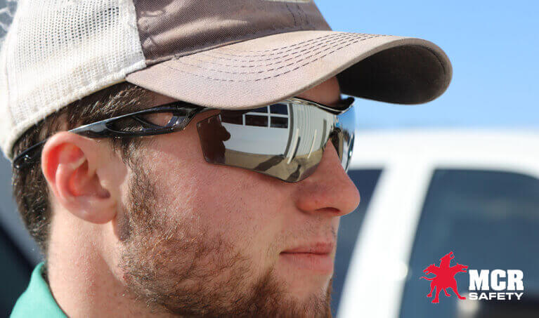 Worker wearing MCR Safety Checklite CL5 Safety Glasses